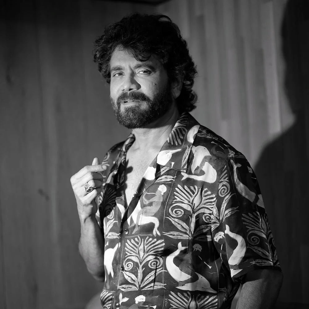Nagarjuna_Akkineni wearing a patterned shirt with orionz jewellery in a black and white photo