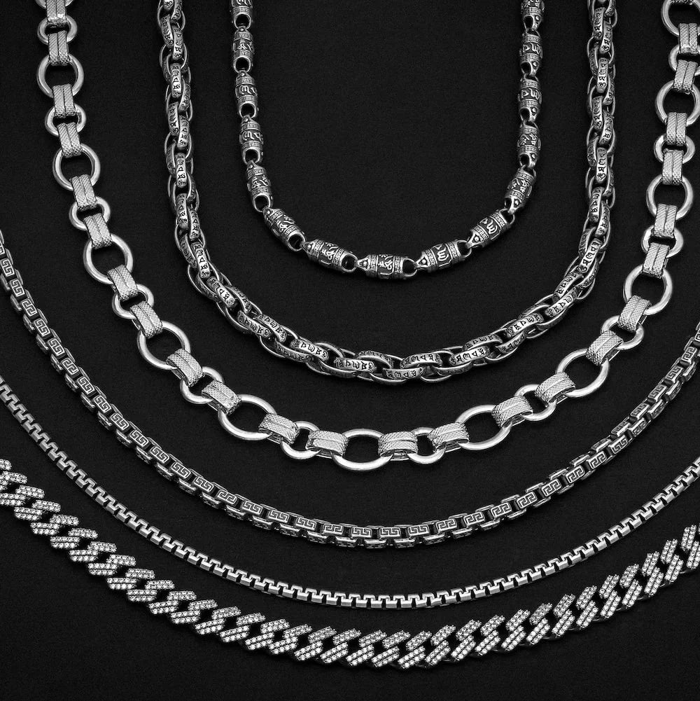 Set of silver orionz chains on a black background