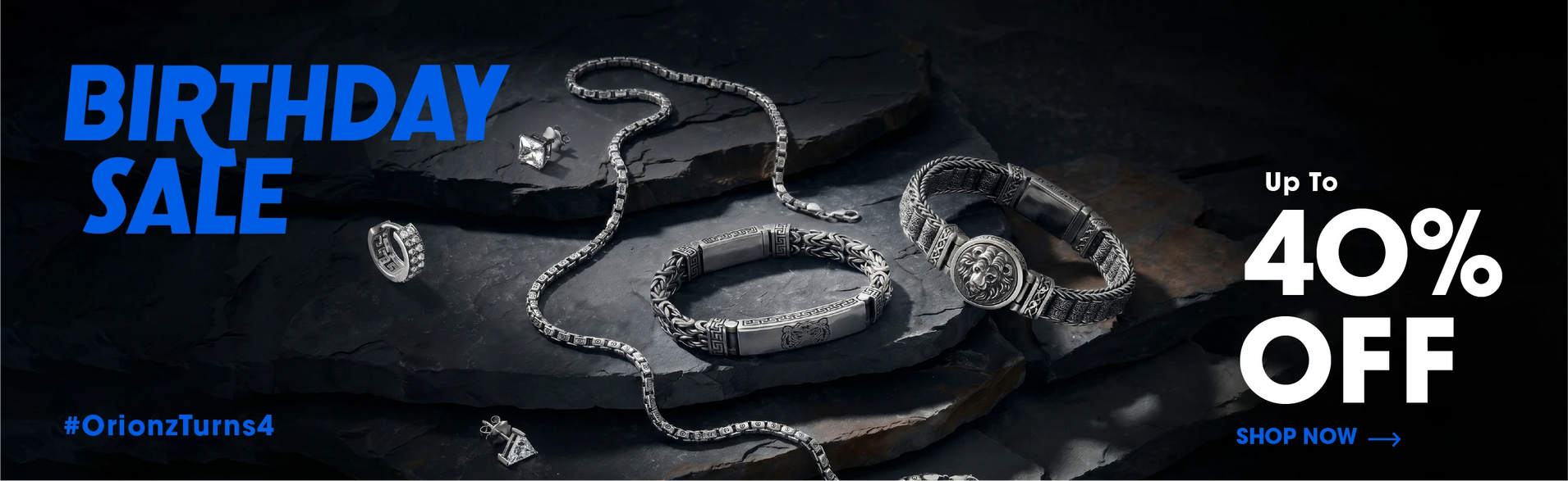 Jewelry display with 'Birthday Sale' text and discount offer on a dark background.