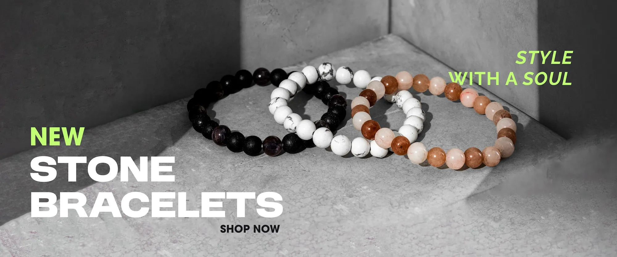 Three stone bracelets on a gray surface with promotional text.