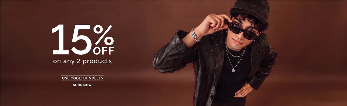A promotional lifestyle image featuring a young man wearing a black leather jacket, black cap, black sunglasses, and black sneakers, posed against a solid dark brown background. Large white text at the top reads '15% OFF on any 2 products' with a code 'BUNDLE15' and 'SHOP NOW' at the bottom right.