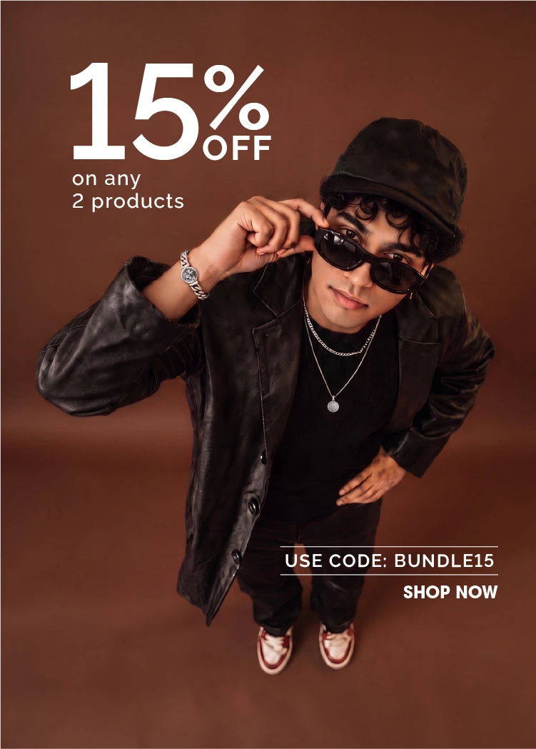 A promotional lifestyle image featuring a young man wearing a black leather jacket, black cap, black sunglasses, and black sneakers, posed against a solid dark brown background. Large white text at the top reads '15% OFF on any 2 products' with a code 'BUNDLE15' and 'SHOP NOW' at the bottom right.