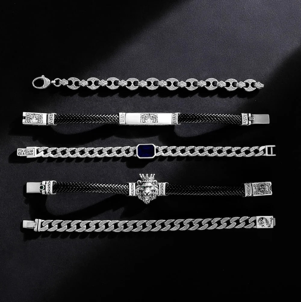 Set of orionz silver bracelets with various designs on a black background