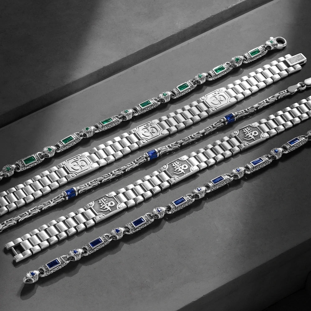 orionz Silver bracelets with gemstone accents on a dark surface