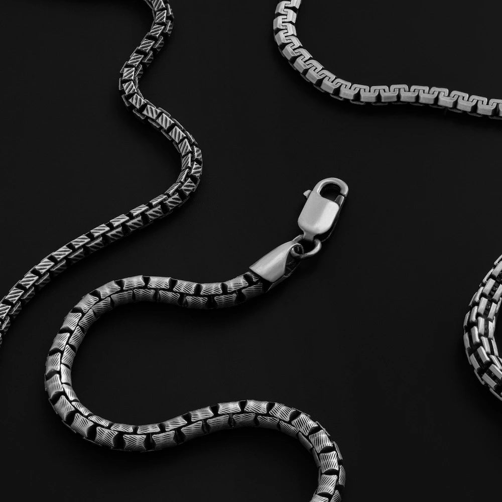 orionz Silver chain bracelets on a black background