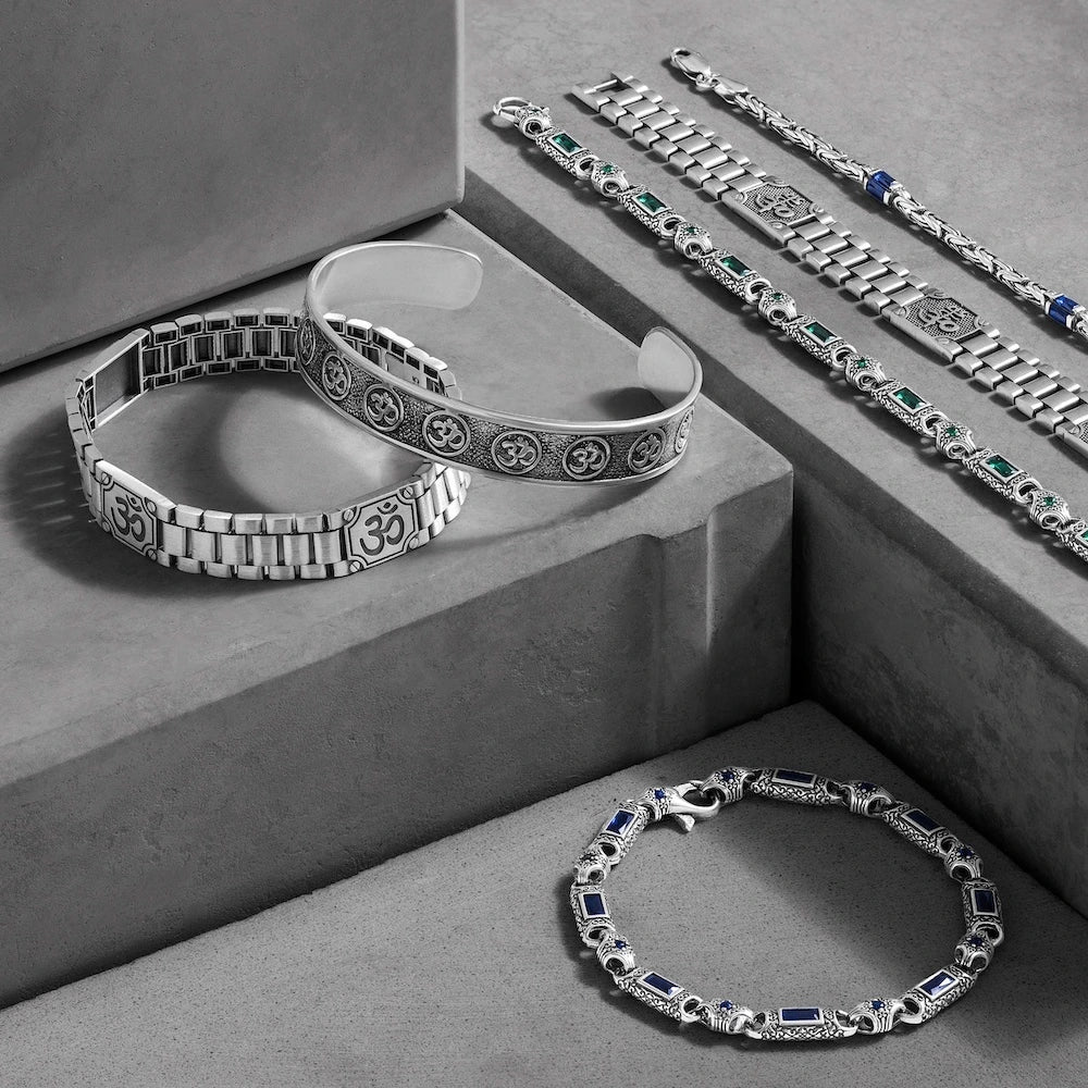 orionz Silver bracelets with gemstones on a gray surface