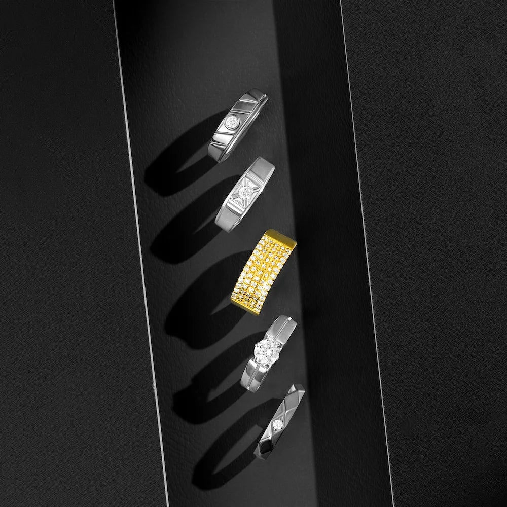 Collection of diamond rings on a black background