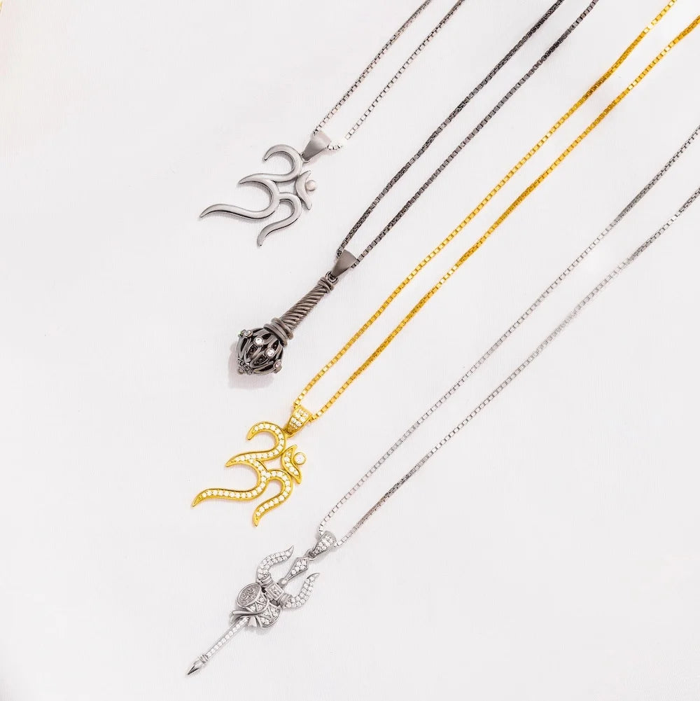 Three orionz necklaces with unique pendants on a white background